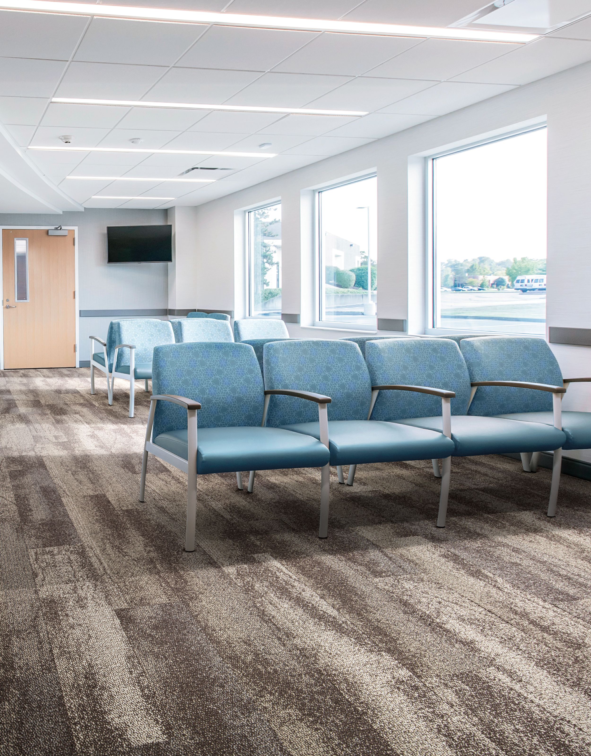 Interface Neighborhood Smooth plank carpet tile in waiting room with blue chairs image number 8